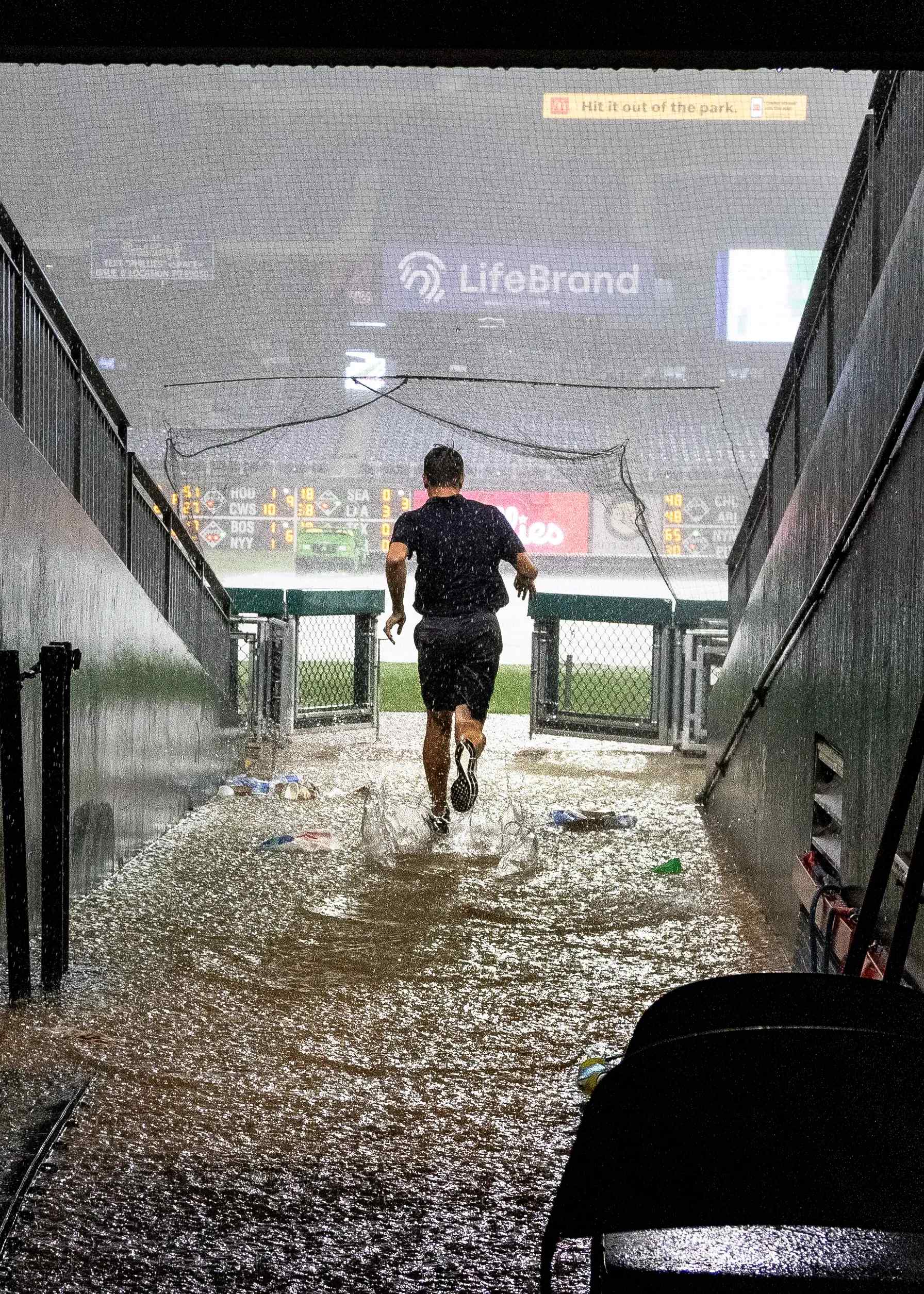 An athlete entering a rainy arena
